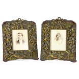 A PAIR OF 19TH CENTURY EMBOSSED AND PATINATED COPPER PHOTOGRAPH FRAMES, THE BEADED CENTRE SURROUNDED