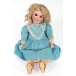 A LARGE EARLY 20TH CENTURY ARMAND MARSEILLE BISQUE HEADED DOLL WITH BROWN WEIGHTED EYES AND OPEN