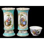 A PAIR OF CONTINENTAL PORCELAIN SPILL VASES PAINTED WITH SCENES OF RUSTIC COURTSHIP ON A TURQUOISE