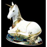 A ROYAL CROWN DERBY PORCELAIN LIMITED EDITION MILLENIUM UNICORN DESIGNED BY LOUISE ADAMS, NUMBER 874