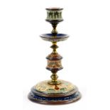 A BRASS MOUNTED DOULTON WARE CANDLESTICK BY FRANK A. BUTLER, 20CM H, IMPRESSED MARK, INCISED