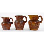 THREE SALTGLAZED BROWN STONEWARE HUNTING JUGS WITH HOUND HANDLE, 14CM - 18CM H, 19TH CENTURY