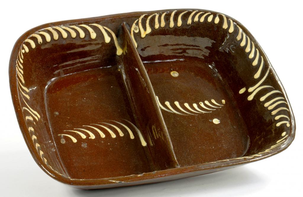 AN ENGLISH SLIPWARE DIVIDED OBLONG DISH WITH CREAM SLIP COMB DECORATION, 38CM W, 19TH C