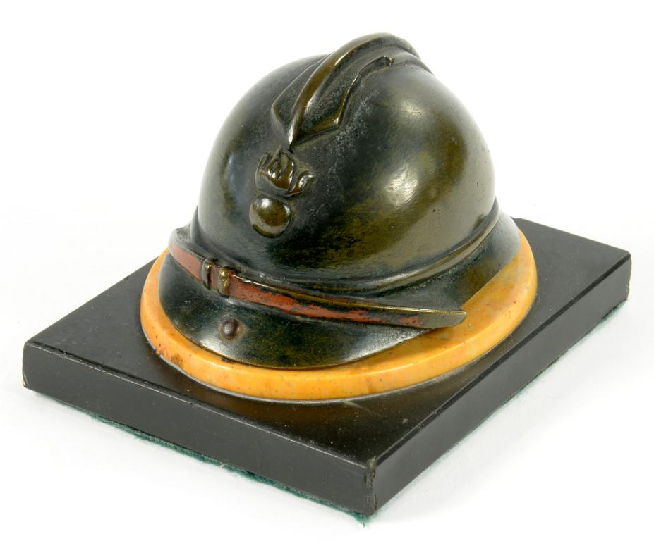 A FRENCH BRONZE SIENNA MARBLE AND POLISHED SLATE DESK WEIGHT IN THE FORM OF FIREMAN'S HELMET, 6CM H,