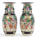 A PAIR OF CHINESE CRACKLE GLAZED VASES, ENAMELLED IN FAMILLE ROSE WITH WARRIORS, 46CM H, CIRCA EARLY