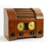 A GOBLIN WALNUT MAINS RADIO WITH BAKELITE KNOBS, 44CM W