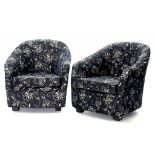 A PAIR OF BLACK AND WHITE FABRIC COVERED TUB CHAIRS