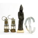 TWO MINER'S LAMPS, AN ALUMINIUM SCULPTURE AND A POTTERY SCULPTURE OF A FIGURE