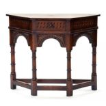 AN OLD REPRODUCTION CARVED OAK CREDENCE TYPE TABLE, 87CM W