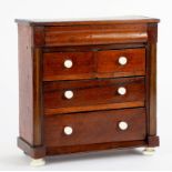 A 19TH CENTURY MINIATURE (APPRENTICE PIECE) CHEST OF DRAWERS WITH CERAMIC BUN HANDLES, 25CM W X 26.