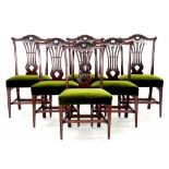 A SET OF SIX CARVED MAHOGANY DINING CHAIRS
