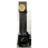 A LATE VICTORIAN CARVED AND DARK STAINED OAK EIGHT DAY LONGCASE CLOCK, WITH ROUND BRASS DIAL, THE
