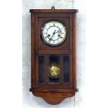 AN OAK WALL CLOCK BY GUSTAVE BECKER, 56CM H