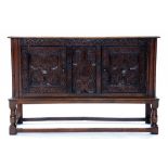 A CARVED OAK SIDEBOARD, 139CM W