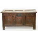 AN 18TH CENTURY AND LATER CARVED OAK PANELLED BLANKET CHEST, 119CM W