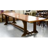 *AN OAK EXTENDING REFECTORY TABLE WITH BOARDED TOP, 337CM X 90CM AND AN OAK BOW FRONTED SIDETABLE,