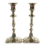 A PAIR OF VICTORIAN EPNS SHELL CORNERED CANDLESTICKS, NOZZLES, 25CM H