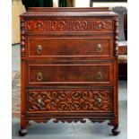 A CARVED MAHOGANY BEDROOM SUITE COMPRISING OF A CHEST OF DRAWERS, BEDSIDE CABINET, DRESSING TABLE