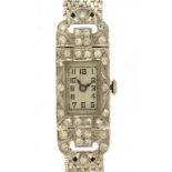 A SWISS DIAMOND SET PLATINUM COCKTAIL WATCH with articulated lugs, on later 9ct white gold bracelet,