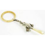 A GEORGE V SILVER RABBIT NOVELTY BABY'S RATTLE with mother of pearl handle, 16.5cm l overall, by