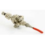 A VICTORIAN SILVER BABY'S RATTLE hung with eight bells, coral handle, 14.5cm l, by George Unite,