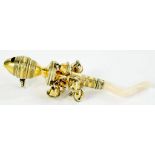 A GEORGE III SILVER GILT BABY'S RATTLE with oviform whistle hung with eight bells, white coral