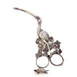A PAIR OF DECORATIVE GERMAN CAST SILVER STORK AND BABE SCISSORS the bird standing on a tortoise,