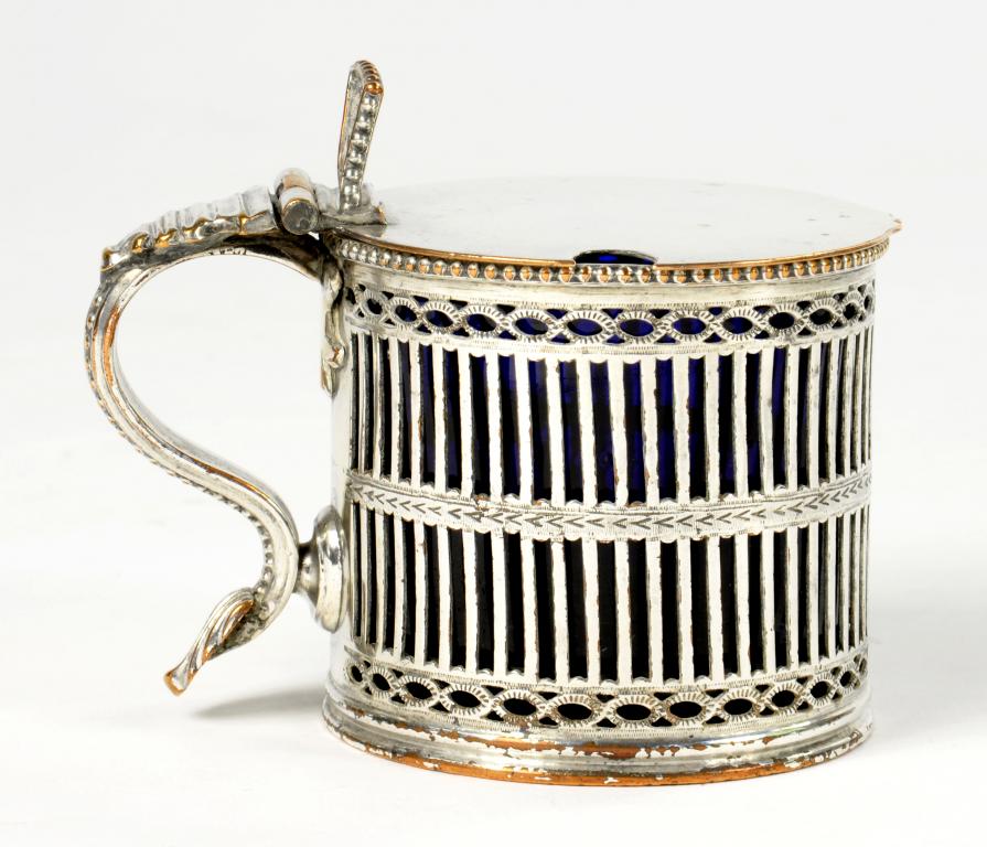 A PIERCED AND ENGRAVED SHEFFIELD PLATE CYLINDRICAL MUSTARD POT, C1775 blue glass liner, 6.5cm h ++