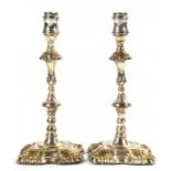 A PAIR OF SHEFFIELD PLATE CANDLESTICKS BY TUDOR & CO, C1765 24.5cm h ++Even moderate wear