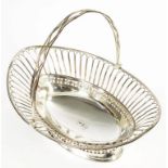 A SHEFFIELD PLATE WIREWORK CAKE OR BREAD BASKET, C1780 with pierced and engraved paterae borders,