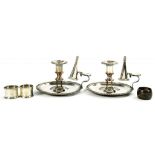 A PAIR OF OLD SHEFFIELD PLATE GADROONED CHAMBERSTICKS, C1825 with extinguisher, 14.5cm diam and
