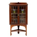 AN EDWARDIAN MAHOGANY CORNER CABINET WITH LEADED GLASS DOORS, 142CM H