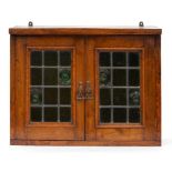 AN OAK WALL HANGING CABINET WITH LEADED GLASS DOORS AND SMALL OAK SUTHERLAND TABLE