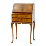 A GEORGE I STYLE DWARF WALNUT BUREAU, 52CM W