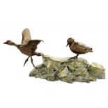 A BRONZE SCULPTURE OF TWO BIRDS ON ROCKS, BROWN AND GREEN PATINA, 15CM H, LATE 20TH C