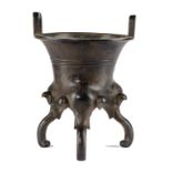 A CHINESE BRONZE TRIPOD CENSER, 19TH C 22cm h ++Undamaged, somewhat uneven patina, greenish on the