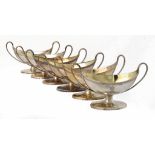 A SET OF SIX GEORGE III SILVER NAVETTE SHAPED SALT CELLARS crested, 8cm h, by Henry Chawner,