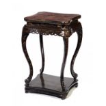 A ENGLISH CHINOISERIE JAPANNED STAND, EARLY 19TH C with carved frieze, the apron fitted with a