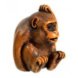 A JAPANESE WOOD NETSUKE OF A MONKEY SCRATCHING ITS HEAD, SIGNED BUNRAKU (BUNGAKU) MEIJI PERIOD, LATE