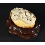 A CHINESE JADE PEBBLE CARVING OF AN IMMORTAL AND BAT, THE REVERSE WITH RUSSET OCHRE SURFACE 7.5cm