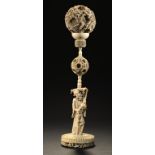 A CHINESE IVORY PUZZLE BALL AND STAND, 19TH C the outermost ball carved with dragons, 36cm h ++