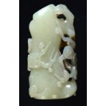 A CHINESE CELADON AND RUSSET JADE PEBBLE CARVING OF PRUNUS 5.4cm ++In good condition