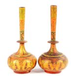A PAIR OF PAINTED AND RICHLY GILT PAPIER MACHE FLASKS WITH BOTTLE SHAPED VASES, NORTH INDIA OR