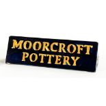 A MOORCROFT TRIANGULAR MOORCROFT POTTERY RETAILER'S SIGN, 18.5CM L, IMPRESSED AND PAINTED MARKS