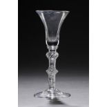 AN ENGLISH WINE GLASS, C1760 THE WAISTED BELL BOWL WITH SOLID BASE AND TWO REEDS ON SINGLE SERIES