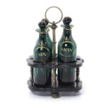 AN ENGLISH BRASS AND BLACK PAPIER MÂCHÉ CRUET FRAME AND FOUR CONTEMPORARY GILT GREEN GLASS CONDIMENT