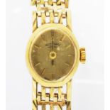 A ROTARY 9CT GOLD LADY'S WRISTWATCH, ON 9CT GOLD BRACELET, 17.6G