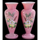 A PAIR OF 19TH CENTURY ENAMELLED PINK CASED GLASS VASES, 23.5CM H