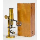 A LATE VICTORIAN LACQUERED BRASS MICROSCOPE, 17.5CM H, VARNISHED LIGHTWOOD CASE