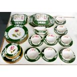 AN EXTENSIVE SPODE BONE CHINA BOTANICAL DINNER SERVICE, LATE 20TH CENTURY WITH DARK GREEN GROUND,